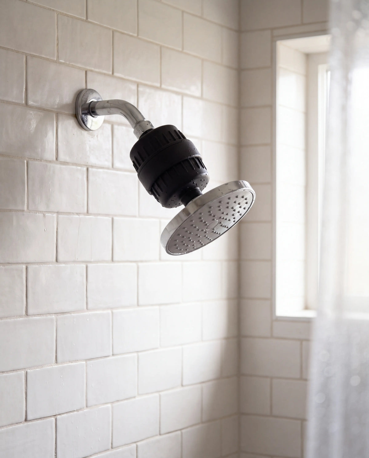 Calore Relief installed between a shower arm and a rain showerhead